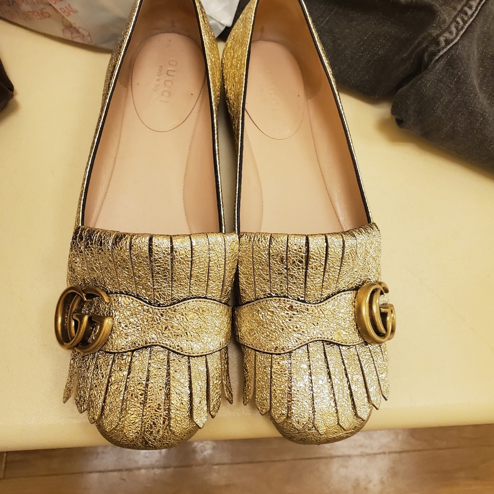 Gucci gold loafers